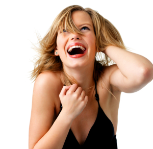 Attractive young woman with hand in hair, laughing